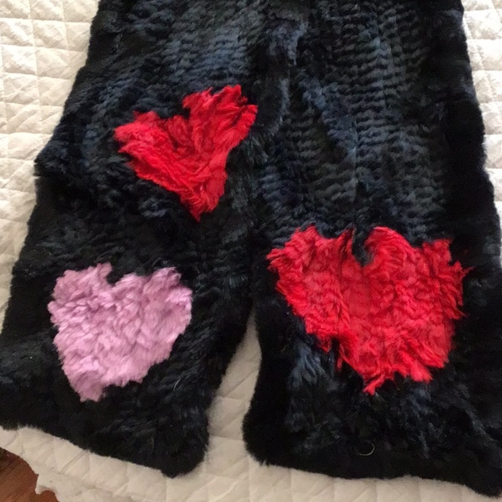 Gorgeous fur scarf with red and pink hearts at ends. 65” in length.